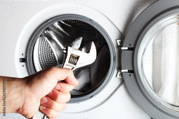 Obraz washing machine spanner repair hand