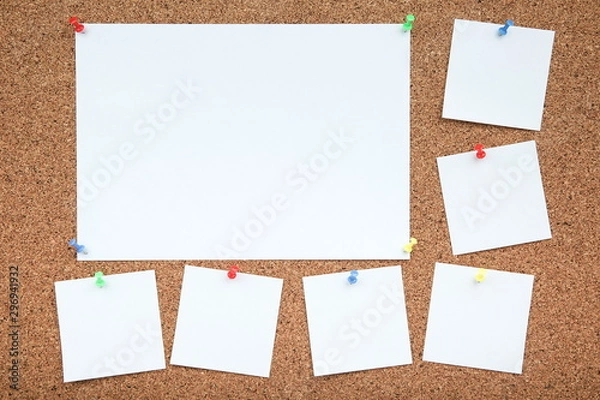 Obraz a sheets of paper are attached to the cork Board with a push-buttons. empty note papers pinned on corkboard
