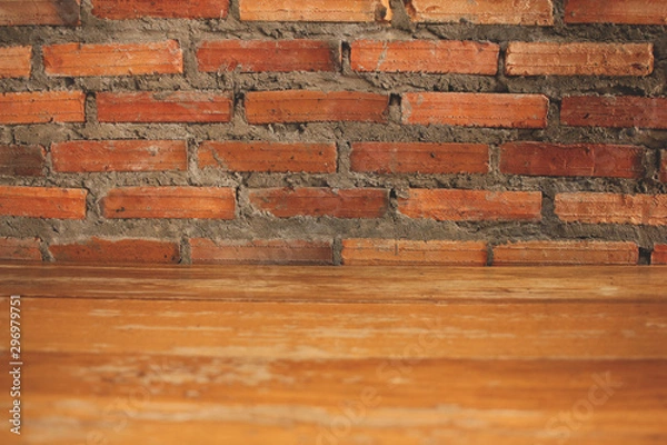 Fototapeta Wooden table in front Brick wall background