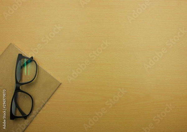 Fototapeta book and glasses on Wooden table