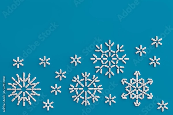 Fototapeta A lot of pills scattered on a blue background in the form of snowflakes . 3D illustration