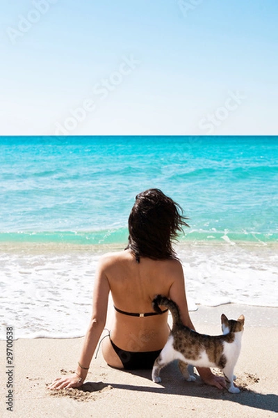 Obraz Girl on the beach with a kitten