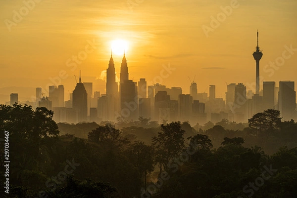 Fototapeta Majestic sunrise over downtown Kuala Lumpur, a capital of Malaysia. Its modern skyline is dominated by the 451m-tall Petronas Twin Towers. 