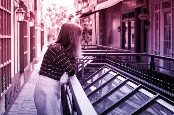 Fototapeta Female waiting or seeing some things, multi color filtered.