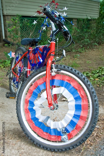 Obraz Children bike decorated in american flags prepared for 4th July