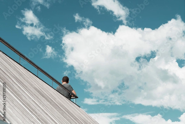 Obraz Man under the blue sky with white clouds
