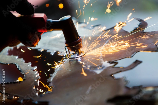 Fototapeta Plasma torch (also known as a plasma arc, plasma gun, or plasma cutter, plasmatron). Metal cutting. DIY instruments. Metall welding