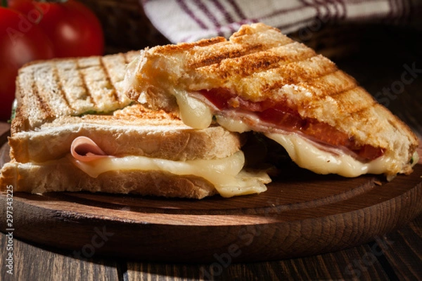 Fototapeta Panini with ham, cheese and lettuce sandwich