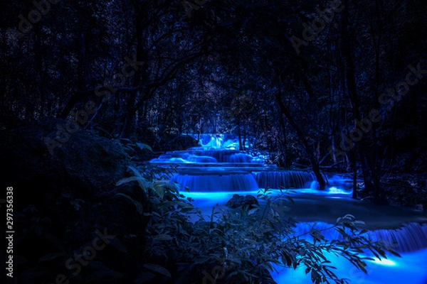 Fototapeta Beautiful waterfall nature scenery of colorful at a night deep tropical fantasy jungle