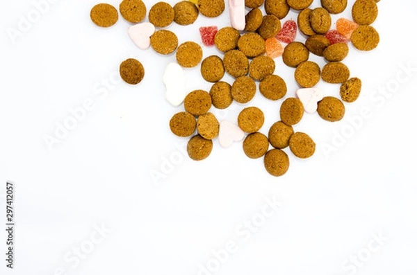 Fototapeta Sinterklaas spices nuts and candies on a white background with space for text