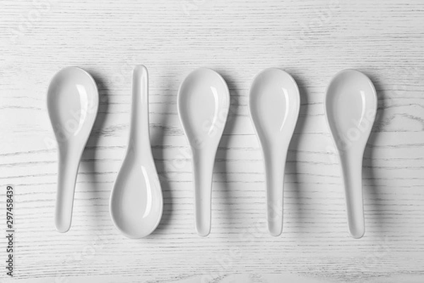 Fototapeta Flat lay composition with miso soup spoons on white wooden table