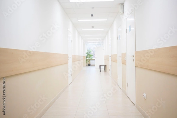 Fototapeta long corridors to hospitals, offices in the hospital. concept of pandemic, coronavirus, virus, disinfection, panic.