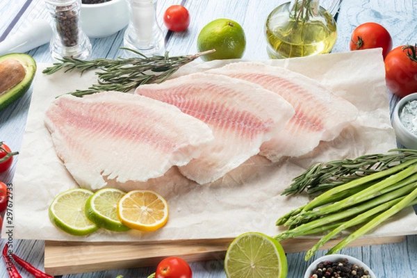 Fototapeta photo seafood and fish on parchment with vegetables on the Board