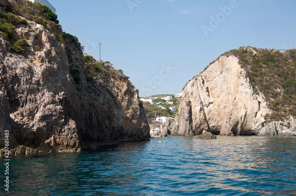 Obraz Rocks and cliffs in the Mediterranean sea of ​​the island of Ponza, Lazio region, Italy. Passage berween the rocks in the sea.