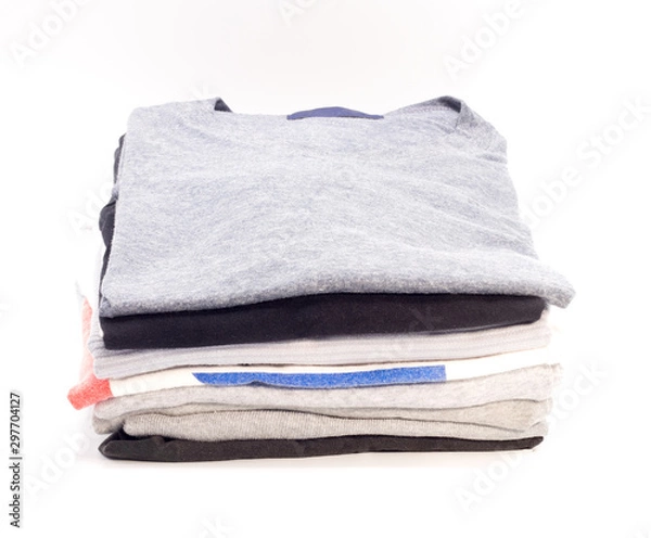 Obraz Clothes folded on a white background.