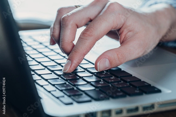 Obraz Woman working at home office hand on keyboard close up