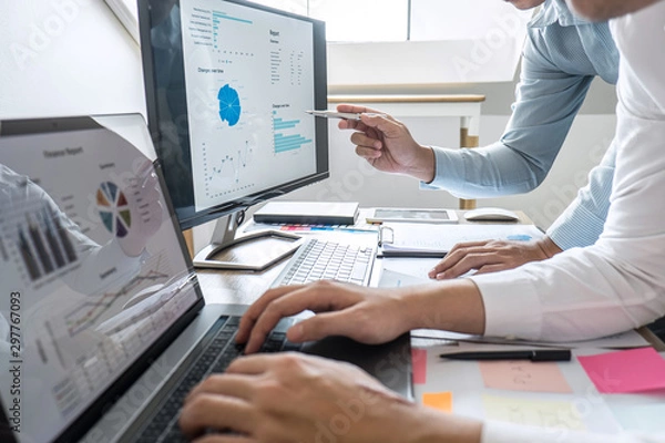 Fototapeta Group of Business casual team conference on meeting presentation to planning investment project working and strategy of business making conversation with partner, financial and accounting concept