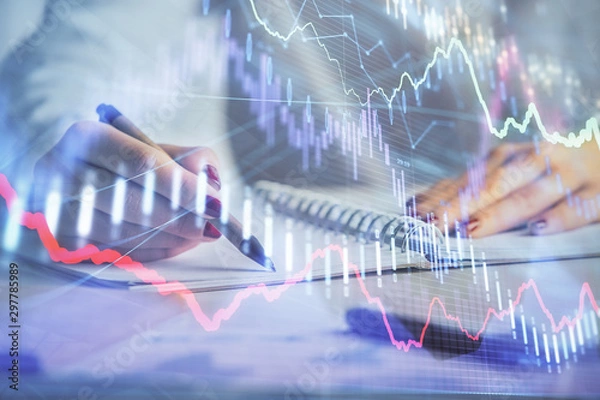 Obraz Double exposure of woman's hands making notes with forex graph hologram. Concept stock market analysis.