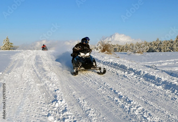 Obraz mans goes on a snowmobile