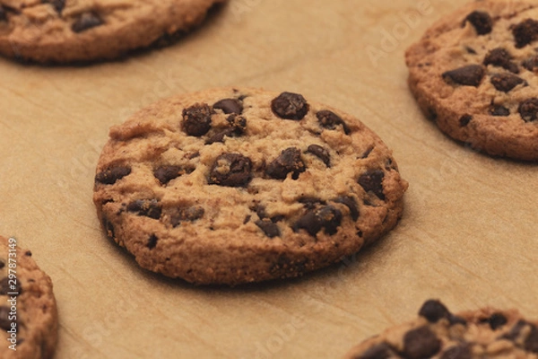 Fototapeta Homemade chocolate cookies on baking paper. Closeup