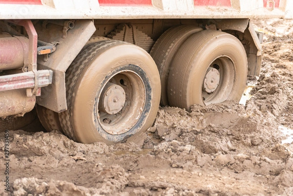 Obraz Stuck truck. The rear wheels are muddy. Blurred primer.