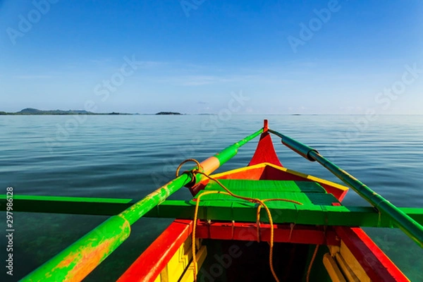 Fototapeta The prow of a banca boat on the calm waters of the cotivas island, Caramoan, Camarines Sur Province, Luzon, Philippines. Region for many Survivor TV shows filming.