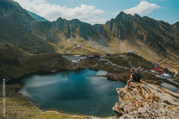 Fototapeta Photographer takes the picture Panorama from 2000 meters altitude where you can see Bâlea Lac, Bâlea Lac chalet and Transfăgărășan road.