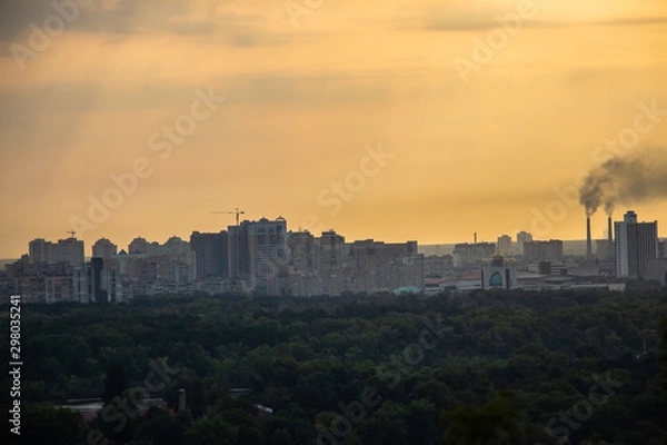 Fototapeta Tour of Kiev in the center of Europe. View of the Dnieper, Trukhanov island and a foot bridge. Park fountain and sunset on the horizon..