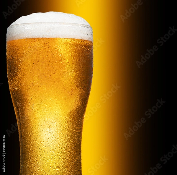 Obraz Glass of cold craft light beer on dark background..