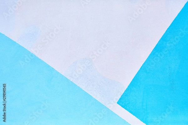 Obraz Blue geometric shapes on a white wooden wall wall located in the corners