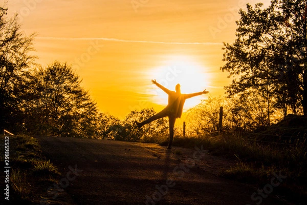 Obraz Female enjoys the sunlight of warm autumn