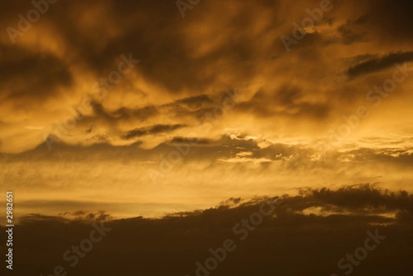 Fototapeta Golden sunset sky and clouds.