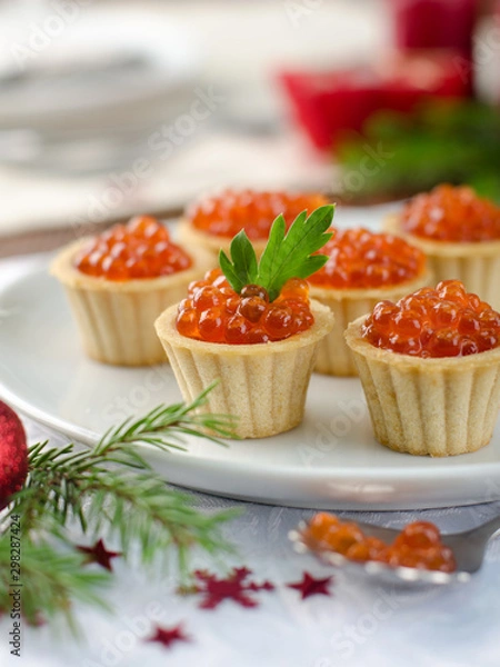 Fototapeta tartlets with red caviar on plate