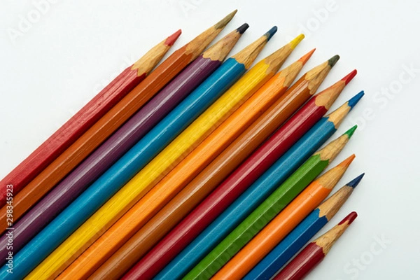 Fototapeta multicolored pencils made of rainbow color on a white background close-up