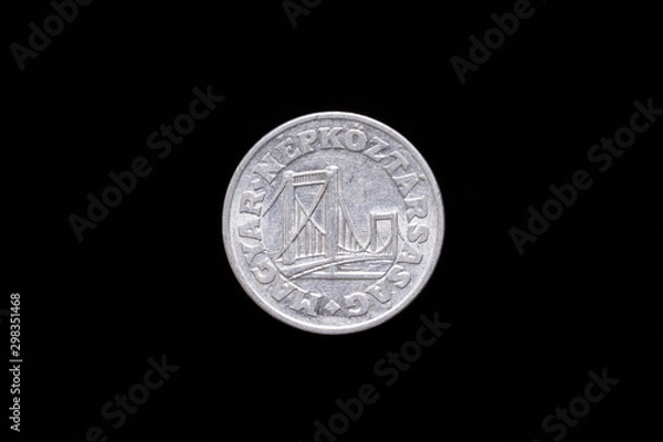 Fototapeta Old Hungarian 50 Filler coin from 1976, obverse showing Elisabeth Bridge in Budapest. Isolated on black background