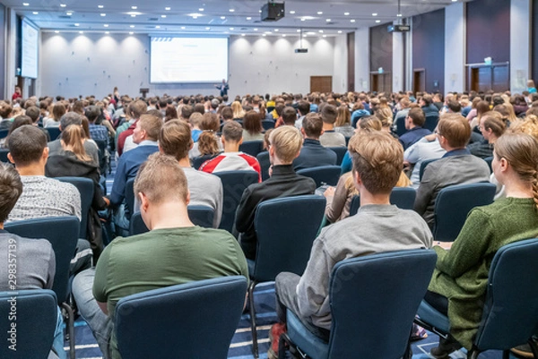 Fototapeta Image of a conference that takes place in a large conference room, workshop for young professionals, training in a large conference room, adult training