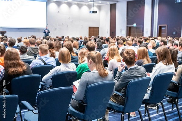 Fototapeta Image of a conference that takes place in a large conference room, workshop for young professionals, training in a large conference room, adult training