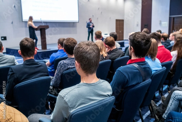 Fototapeta Image of a conference that takes place in a large conference room, workshop for young professionals, training in a large conference room, adult training
