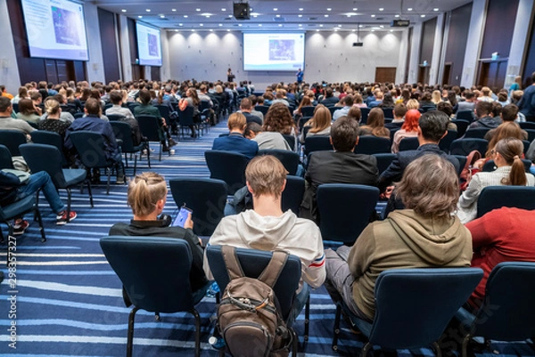 Fototapeta Image of a conference that takes place in a large conference room, workshop for young professionals, training in a large conference room, adult training