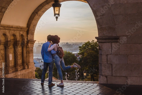 Obraz Young couple enjoy the view from the point from Fisherman Bastion in Budapest during sunrise.