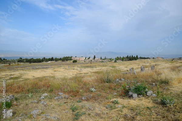 Fototapeta Antique ruins and limestone blocks in Hierapolis, Turkey. Ancient city.