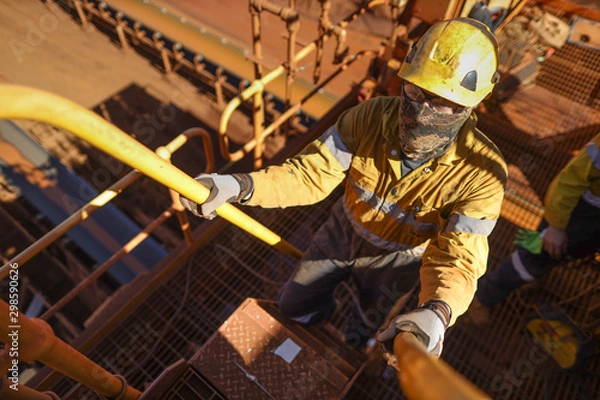 Obraz Miner sign of the working at height, confined space permit on isolation safety control lock box after completed rope access hight risk work 12 Hrs shift construction mine site, Perth, Australia 
