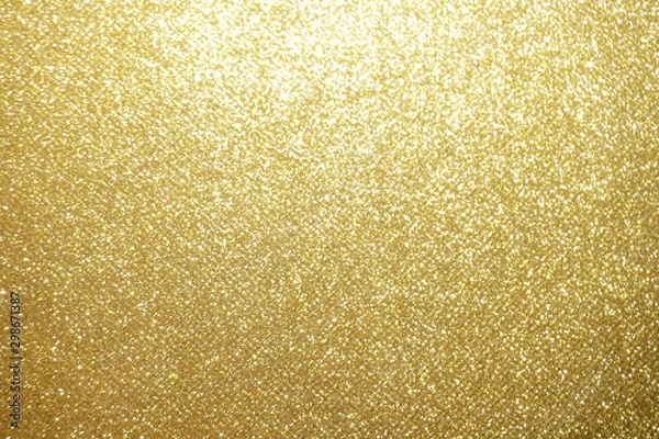 Fototapeta gold Sparkling Lights Festive background with texture. Abstract Christmas twinkled bright bokeh defocused and Falling stars. Winter Card or invitation	