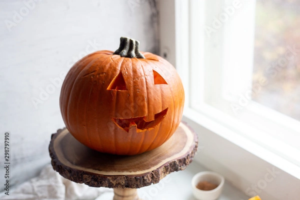 Fototapeta Smiling Jack O' Lantern on marble background. Halloween concept