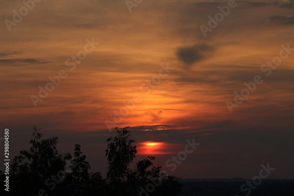 Fototapeta Zachód słońca nad miastem
