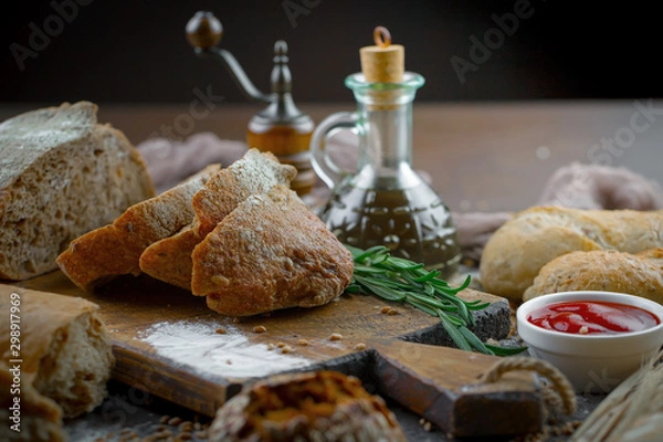 Fototapeta Bread products on the table in composition - close-up