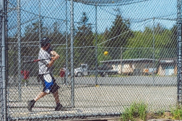 Fototapeta practicing in batting cages