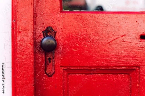 Fototapeta red door and its knob 