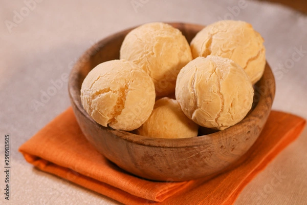 Obraz Pao de Queijo on wooden Bowl. Traditional cheese bread (pão de queijo) bowl on a table