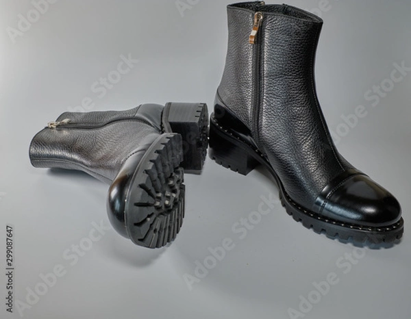 Obraz black boots on white background